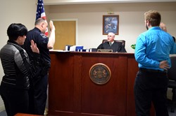 three people in court being sworn in