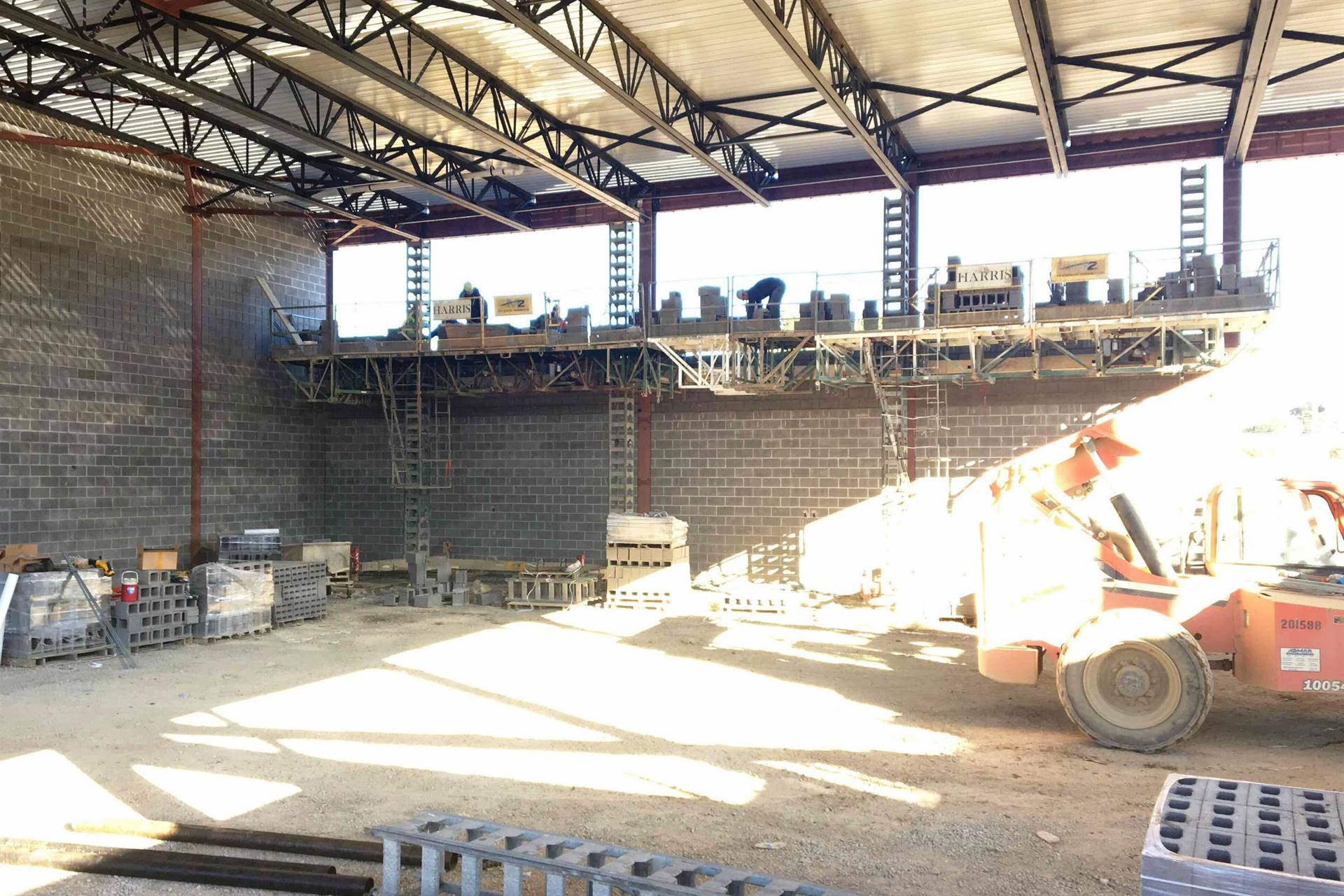 Cinder block gymnasium room with exposed steel beams