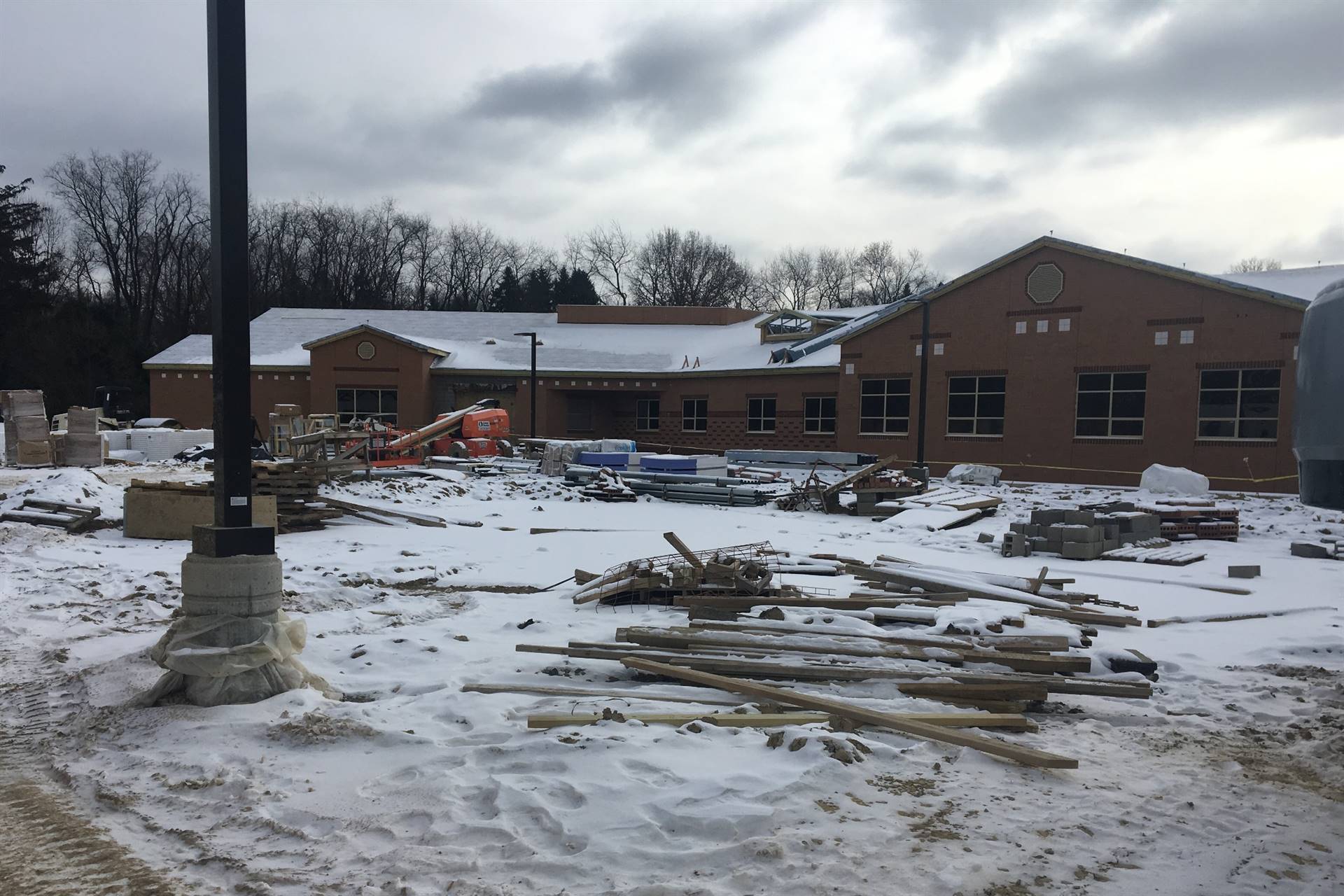 Scott Primary School building with construction material and snow on the ground