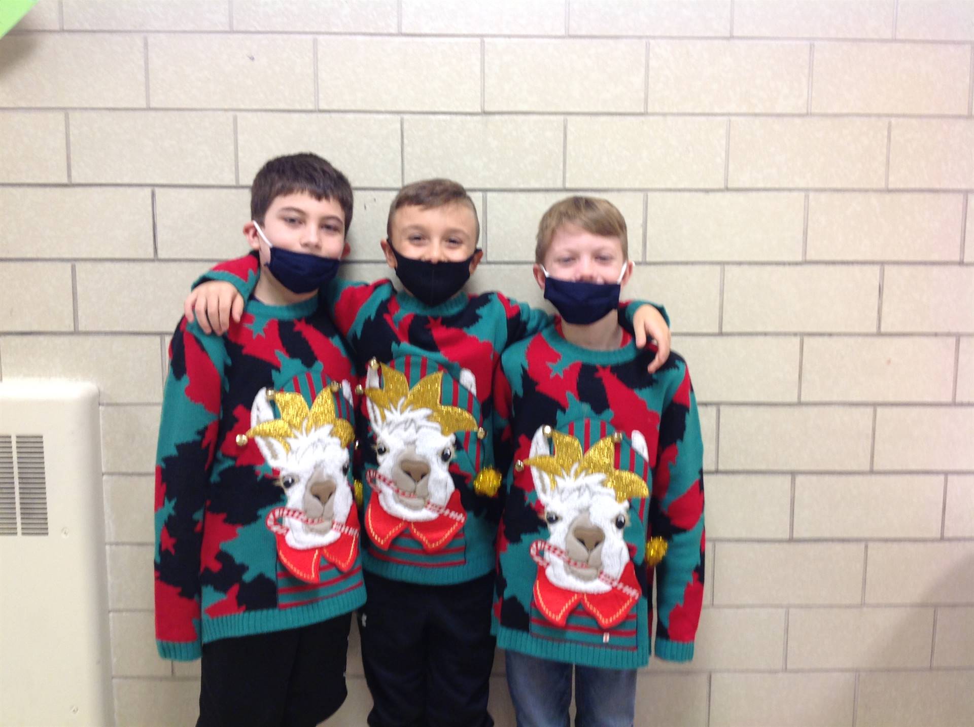 3 Boys Wearing Same Holiday Sweater