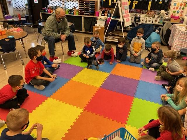 Mr. Pelkofer with students at circle time