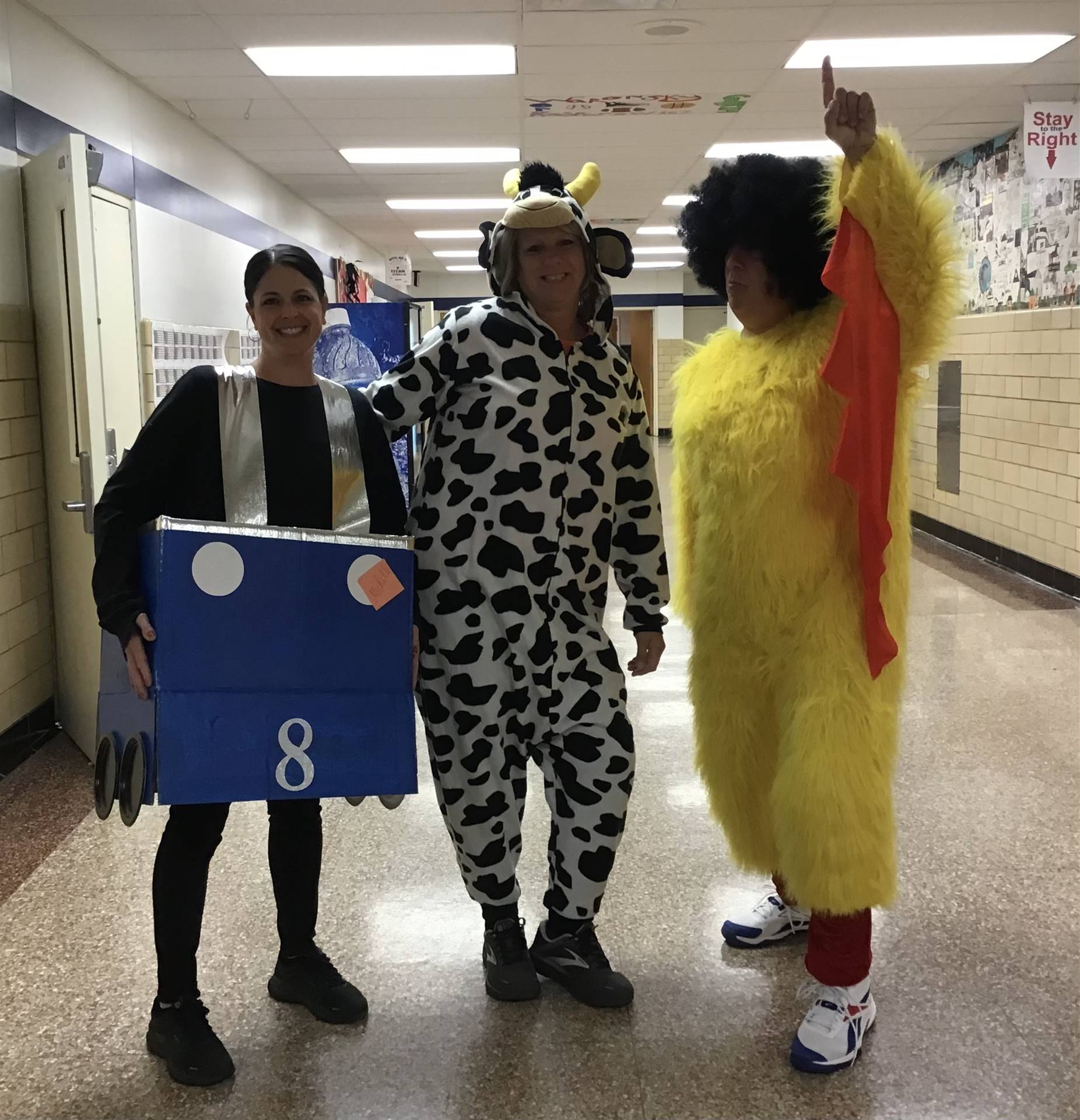 3 SAES staff members in costumes 