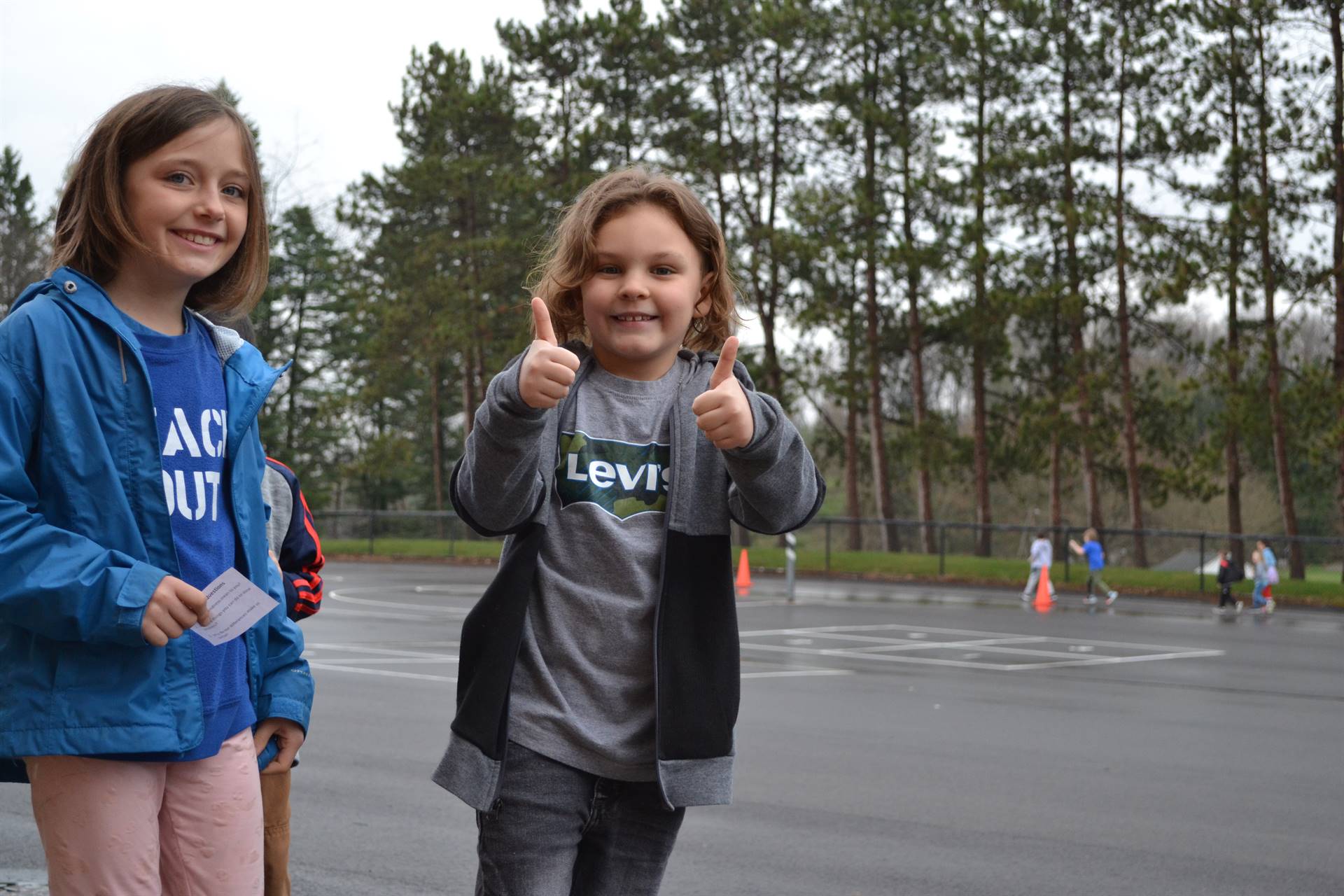 Marzolf student gives 2 thumbs up during the Walk for Kindness