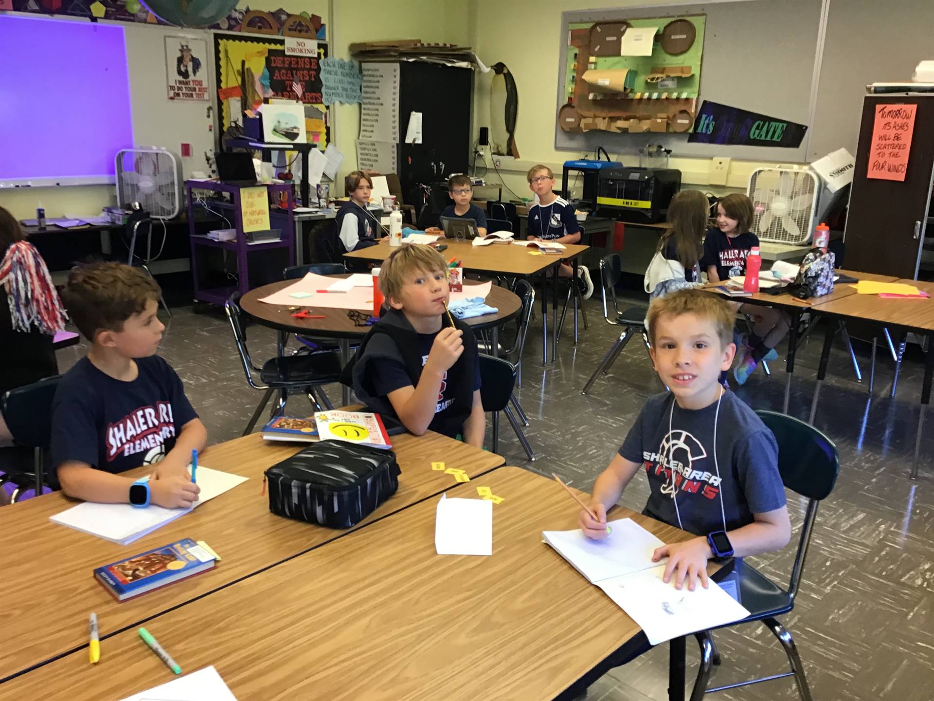 4th graders writing in notebooks