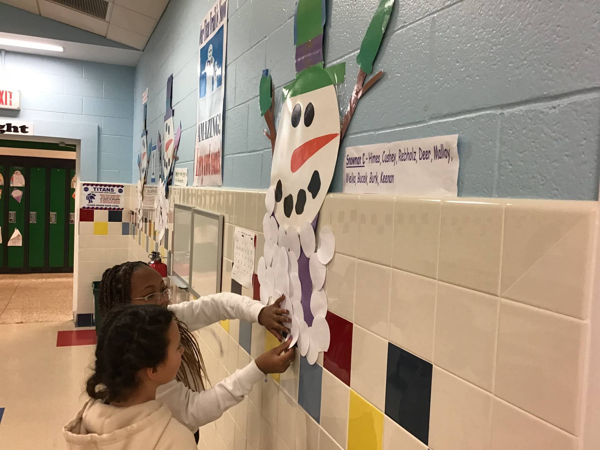 Two students adding snowballs for reading 