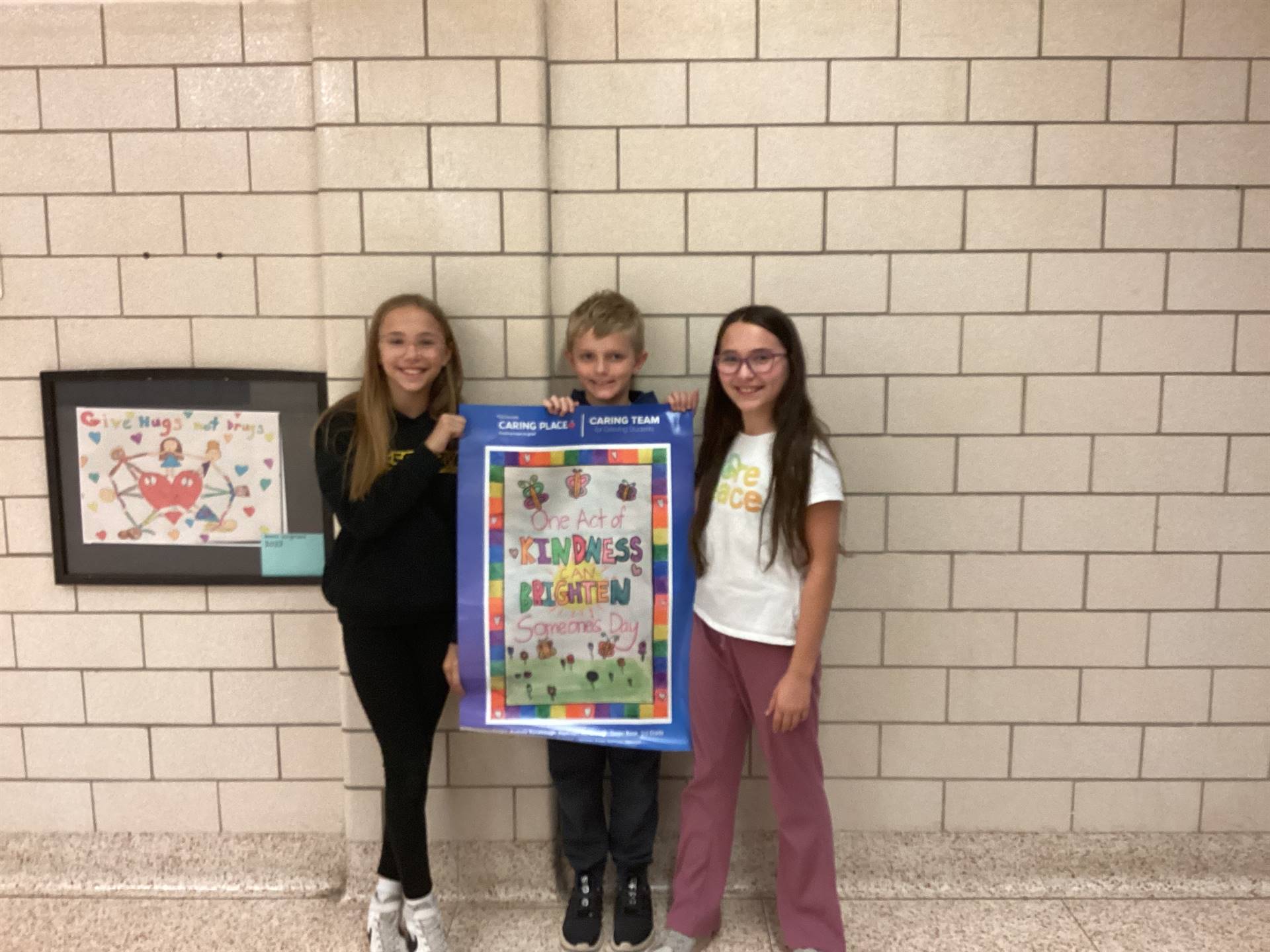 3 students who won Kindness Poster Contest