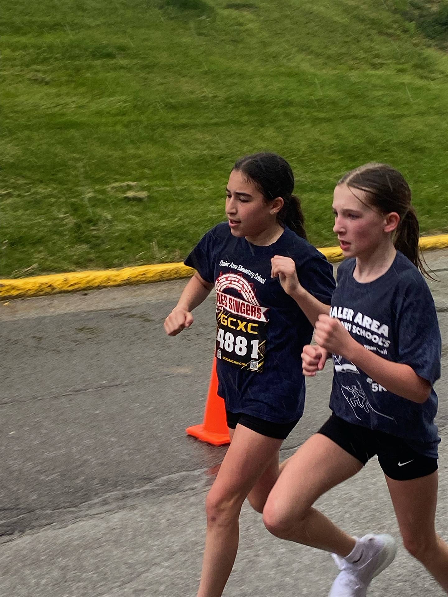 2 girls running at 5K race