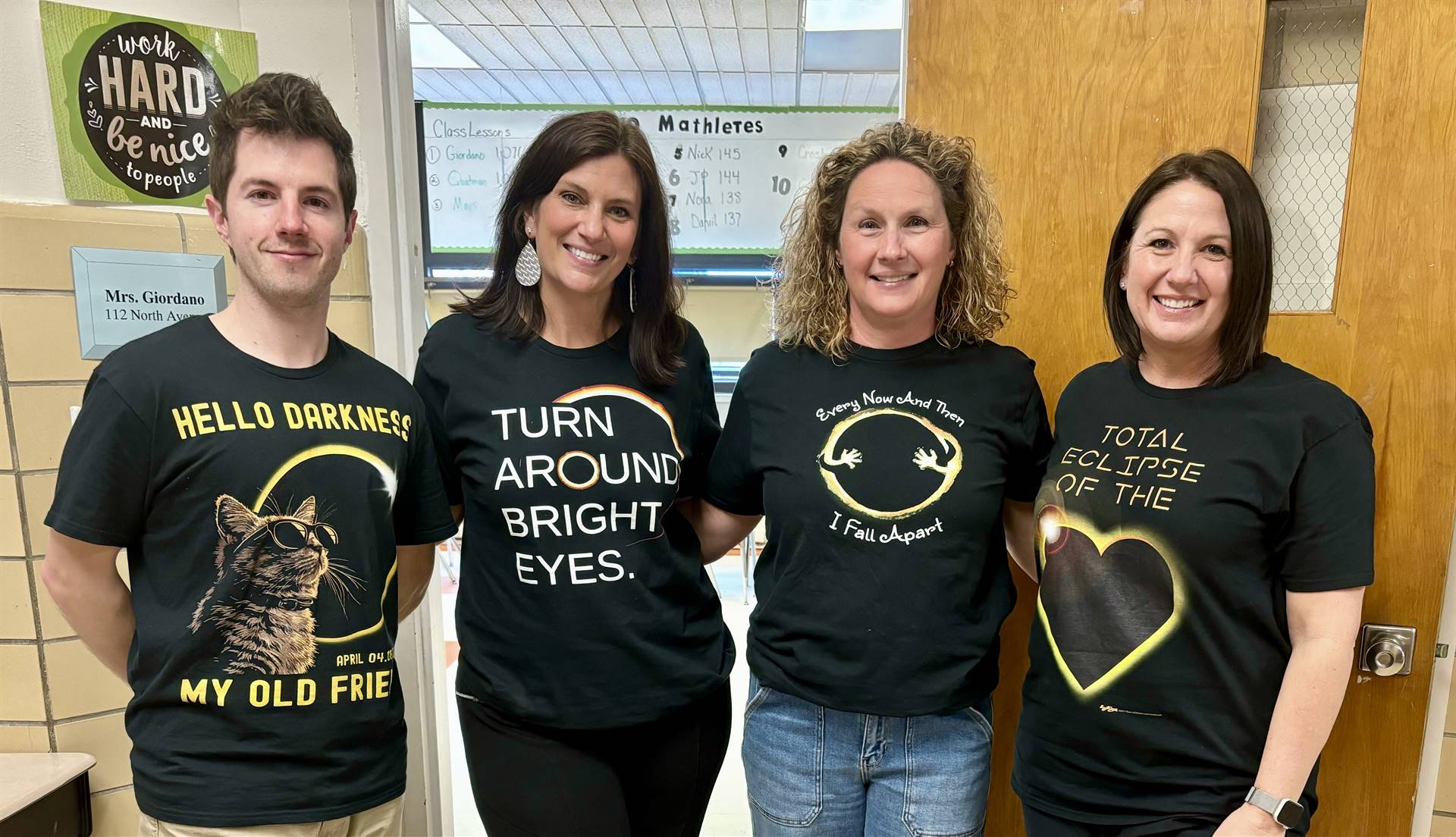 4 teachers wearing eclipse shirts